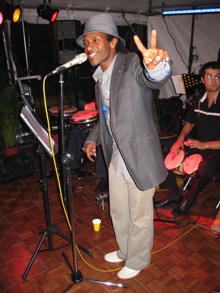 Singer Enrique soundchecking with latin band Jan y su Salsa just before a birthday party in Little Venice